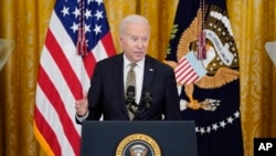 U.S. President Joe Biden speaks at an event in the East Room of the White House, March 16, 2022, in Washington.