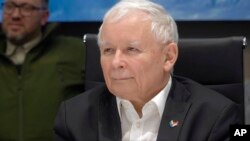 Deputy Prime Minister Jaroslaw Kaczynski listens during a meeting in Kyiv, Ukraine, March 15, 2022, in this image from video provided by the Ukrainian Presidential Press Office.