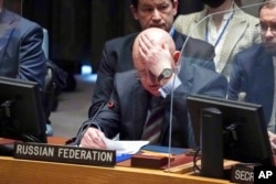 FILE - Russia Ambassador Vassily Nebenzia addresses a meeting of the U.N. Security Council on the humanitarian crisis in Ukraine, March 17, 2022, at U.N. headquarters.