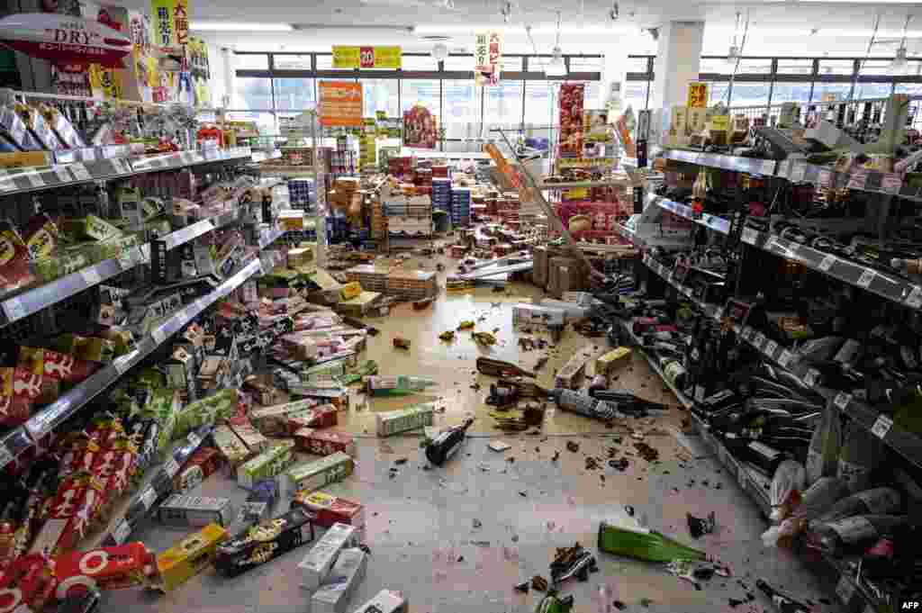 A supermarket is seen with goods on the ground in Shiroishi, Miyagi prefecture after a 7.3-magnitude earthquake shook east Japan the night before.