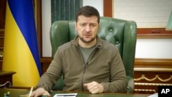 FILE - Ukrainian President Volodymyr Zelenskyy speaks in Kyiv, Ukraine, in this image from video provided by the Ukrainian Presidential Press Office and posted on Facebook on March 12, 2022.