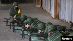 Army reservists take part in a shooting exercise at a base in Nanshipu, Taiwan, March 12, 2022.