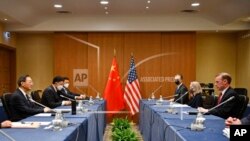 A member of the Political Bureau of the Communist Party of China Central Committee and director of the Office of the Foreign Affairs Commission of the CPC Central Committee, at left meets with U.S. National Security Advisor Jake Sullivan at right in Rome, Italy, March 14, 2022. 