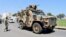 FILE: A military vehicle belonging to the Libyan armed unit 444 Brigade, backing the Government of National Unity (GNU) and Prime Minister Abdulhamid al-Dbeibah, drives in Ain Zara area in Tripoli, Libya, July 22, 2022. 