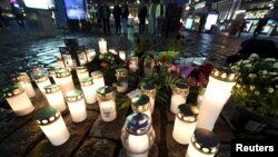Candles at Turku Market Square for the victims of Friday's stabbings are pictured in Turku, Finland Aug. 18, 2017. 