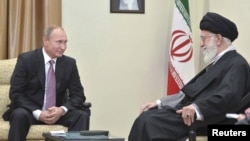 Russia's President Vladimir Putin, left, meets with Iran's Supreme Leader Ayatollah Ali Khamenei in Tehran, Iran, Nov. 23, 2015. 