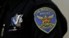 A patch and badge are seen on the uniform of a San Francisco police officer during a news conference Friday, April 29, 2016, in San Francisco. 