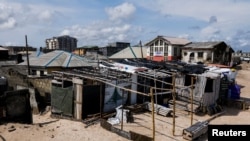 FILE: A view of settlements on the shore of the Alpha beach, affected by an ocean surge, in Lagos, Nigeria June 21, 2022