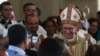 People welcome Vatican Secretary of State Cardinal Pietro Parolin a she arrives to celebrate mass for the dedication and inauguration of the Church of the Baptism of the Lord at Al-Maghtas, 50km west of Amman on the eastern bank of the Jordan River, Jan. 10, 2025. 