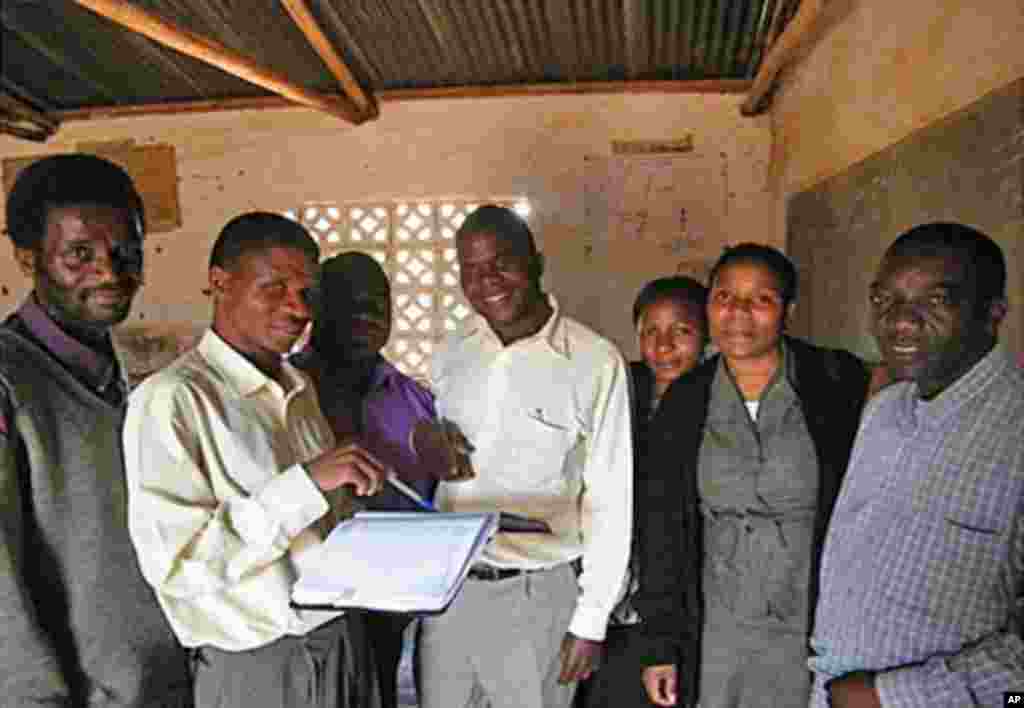 Malawi teachers make use of Go Girls! training materials. (Hilary Schwandt)