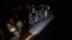 Des migrants à bord d'un bateau gonflable de l'organisation Proactiva Open Arms.
