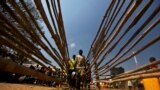 South Sudanese refugees line up for food at the Tzaipi refugee camp in Adjumani, 471 km (293 miles) north of Uganda&#39;s capital Kampala. 