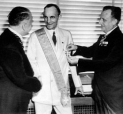 German diplomats award Henry Ford, center, Nazi Germany's highest honor for foreigners, the Grand Cross of the German Eagle, in Detroit on July 30, 1938