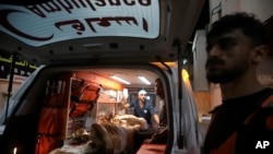 FILE - A Palestinian girl wounded in Israeli bombing in Gaza is brought by ambulance to Kuwaiti Hospital in Rafah refugee camp, southern Gaza Strip, May 3, 2024. The WHO says more than 100 patients will be evacuated from Gaza for medical treatment. 