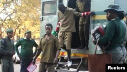FILE - Oppositon supporters arrested for violent protests arrive to submit bail applications at the Harare Magistrates Courts in Harare, Zimbabwe, August 7,2018.