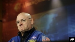 NASA astronaut Scott Kelly listens to a question about his scheduled mission aboard the International Space Station during a briefing at Johnson Space Center in Houston, December 5, 2012.