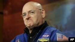 FILE - NASA astronaut Scott Kelly during a briefing at Johnson Space Center in Houston, Dec. 5, 2012.