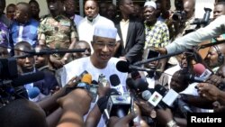 Benin Presidential candidate Lionel Zinsou speaks to journalists after voting during presidential elections in Cotonou, Benin, March 20, 2016.