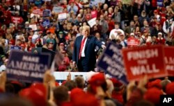 President Donald Trump arrives to speak at a campaign rally at the IX Center, in Cleveland, Nov. 5, 2018.