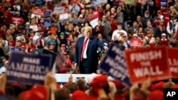 President Donald Trump arrives to speak at a campaign rally at the IX Center, in Cleveland, Nov. 5, 2018.