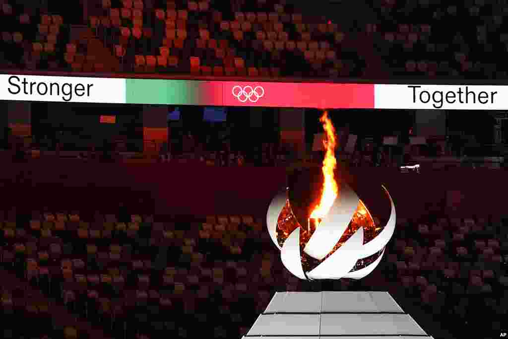 The Olympic flame burns during the closing ceremony in the Olympic Stadium at the 2020 Summer Olympics, Sunday, Aug. 8, 2021, in Tokyo, Japan. (AP Photo/Jae C. Hong)