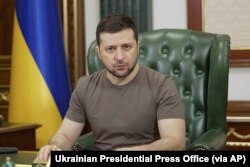 In this image from video provided by the Ukrainian Presidential Press Office and posted on Facebook on March 15, 2022, President Volodymyr Zelenskyy speaks in Kyiv.