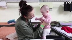 Ukrainian Mom, Baby Share Tender Moments at Polish Shelter 