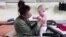 Ukrainian Mom, Baby Share Tender Moments at Polish Shelter 
