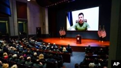 FILE - Ukrainian President Volodymyr Zelenskyy delivers a virtual address to Congress by video at the Capitol in Washington, March 16, 2022. 