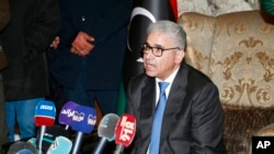 FILE - Fathi Bashagha talks to reporters after east-based lawmakers named him to replace then-Prime Minister Abdul Hamid Dbeibah as head of a new interim government, in Tripoli, Libya, Feb. 10, 2022.