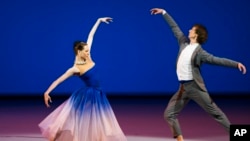 FILE - Bolshoi Ballet soloists and Benois de la Danse laureates Olga Smirnova and Semion Chudin perform the Adagio from the Taming of the Shrew, during a Nominees Gala Concert in the Bolshoi Theater in Moscow, May 26, 2015.