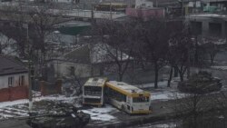 Russian's army tanks move down a street on the outskirts of Mariupol, Ukraine, Friday, March 11, 2022. (AP Photo/Evgeniy Maloletka)