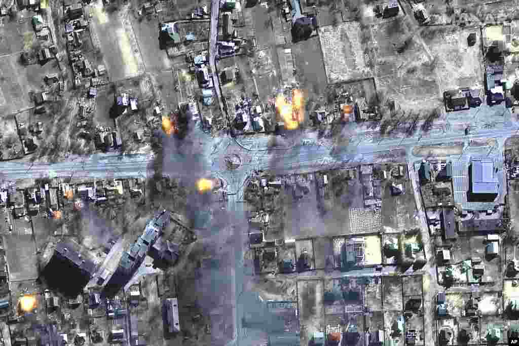 This satellite image provided by Maxar Technologies shows burning buildings in a neighborhood in northeast Chernihiv, Ukraine, March 16, 2022.