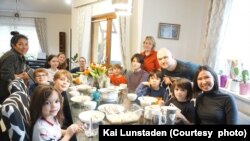 Sapsuda Angsunisanat (right), a Thai graduate student living near Hamburg, Germany, takes care of Ukrainian refugees picked up by her and her German husband Kai Lunstaden (center). They are hosted by a Thai housewife Patsunee Kubiak (left) and her husband Patryk Kubiak.