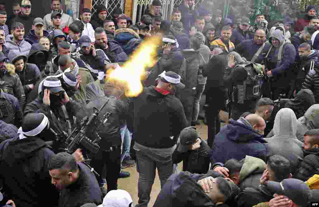 A gunman fires into the air during the funeral of 16-year-old Palestinian Nader Rayan, who was killed by Israeli forces, at the Balata camp near the northern city of Nablus.