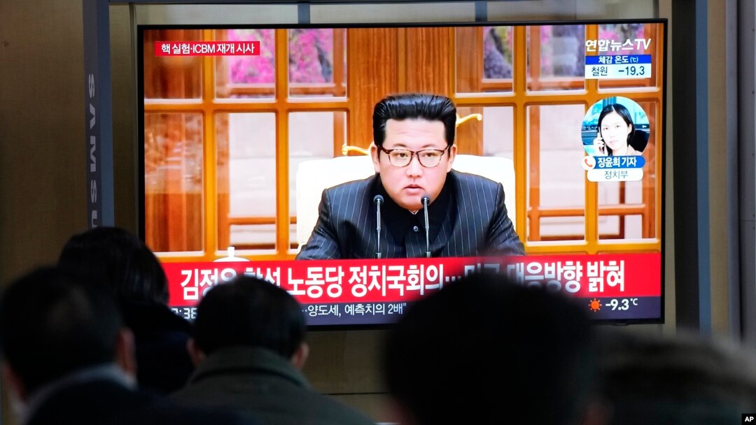 FILE - People watch a TV showing a file image of North Korean leader Kim Jong Un shown during a news program at the Seoul Railway Station in Seoul, South Korea, Thursday, Jan. 20, 2022. (AP Photo/Ahn Young-joon)