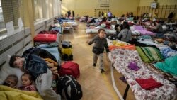 Children play in a temporary shelter for Ukrainian refugees in a school in Przemysl, near the Ukrainian-Polish border on March 14, 2022.