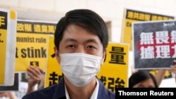 FILE - Former pro-democracy lawmaker Ted Hui appears outside West Kowloon Magistrates' Courts in Hong Kong on Nov. 19, 2020. 