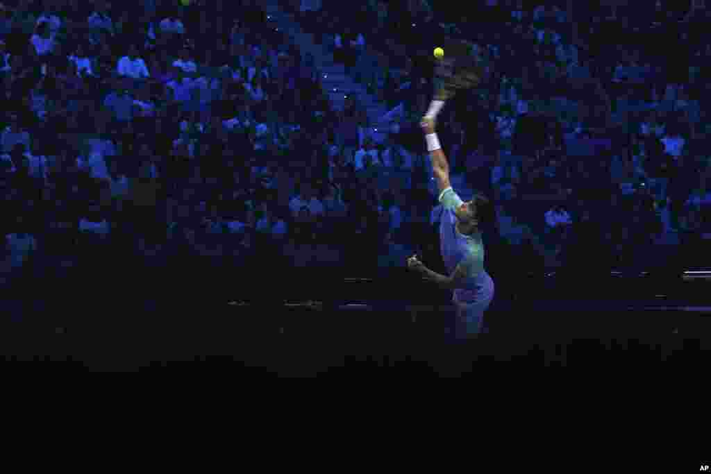 Spain&#39;s Carlos Alcaraz returns the ball to Norway&#39;s Casper Ruud during their singles tennis match of the ATP World Tour Finals at the Inalpi Arena, in Turin, Italy.