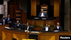 FILE - Chief Justice Mogoeng Mogoeng speaks in Parliament in Cape Town, South Africa, Feb. 15, 2018. 