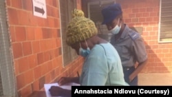 A Bulawayo resident checking her name on Zimbabwe's voters roll on Saturday. (VOA)