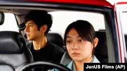 This image released by Janus Films and Sideshow shows Hidetoshi Nishijima, left, and Toko Miura in a scene from "Drive My Car."