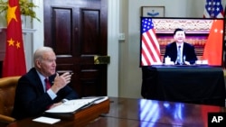 FILE - President Joe Biden meets virtually with Chinese President Xi Jinping from the Roosevelt Room of the White House in Washington, Nov. 15, 2021. The two were to speak again March 17, 2022, about the Russian invasion of Ukraine.