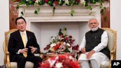 Photograph released by India's Ministry of External Affairs shows Indian Prime Minister Narendra Modi and his Japanese counterpart Fumio Kishida in New Delhi, March 19, 2022. India says ties with Japan are key to stability in the Indo-Pacific region.