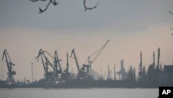 FILE - Harbor cranes are seen at the trade port in Mariupol, Ukraine, Feb. 23, 2022. 