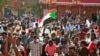 Sudanese protesters march during a demonstration calling for civilian rule and denouncing the military administration, in the capital Khartoum's twin city of Umdurman, on Feb. 14, 2022. 