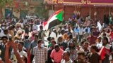 Sudanese protesters march during a demonstration calling for civilian rule and denouncing the military administration, in the capital Khartoum's twin city of Umdurman, on Feb. 14, 2022. 