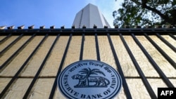 FILE - The logo of the Reserve Bank of India (RBI) is pictured on the gate of the bank's head office in Mumbai, Nov. 17, 2021.