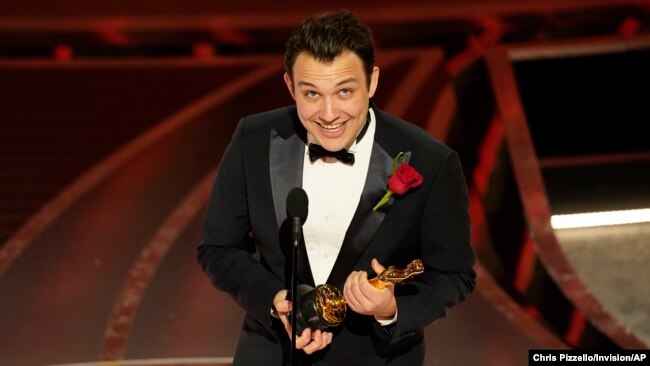 Ben Proudfoot accepts the award for best documentary short subject for "The Queen of Basketball" at the Oscars on Sunday, March 27, 2022, at the Dolby Theatre in Los Angeles.