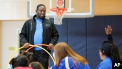 Anthony Gaylor works with children in a before- and afterschool program operated by the YMCA of Middle Tennessee in Nashville, Tenn.